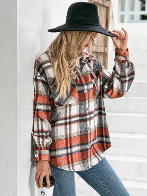 Oversized plaid shacket in orange with button front and patch pockets.