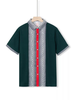 Dark green men's short sleeve shirt with bold geometric print and red button placket.