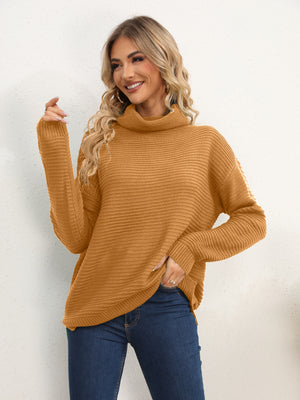 Textured knit oversized turtleneck pullover in mustard acrylic with a relaxed fit.