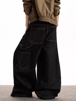 Black belted wide-leg jeans with pockets and contrast stitching.
