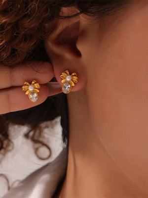 Gold bow stud earrings with pearl and crystal accents