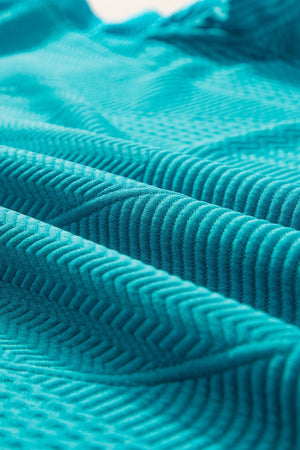 Turquoise textured co-ord short set fabric with chevron pattern detail