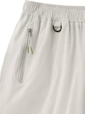 Light gray men's bermuda shorts with zippered pocket and D-ring detail.