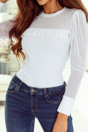 White mesh yoke bodysuit with pearl embellishments and ruffled detail.