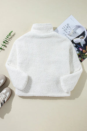 White teddy bear collarless jacket with high neck and long sleeves.
