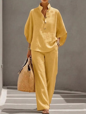 Yellow button-down loungewear set with wide sleeves and relaxed fit pants.