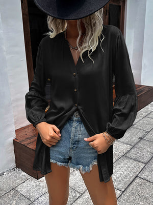 Black oversized blouse with Mandarin collar, button front, and balloon sleeves.