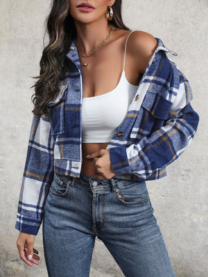 Checked plaid shacket in blue with patch pockets and button closure.