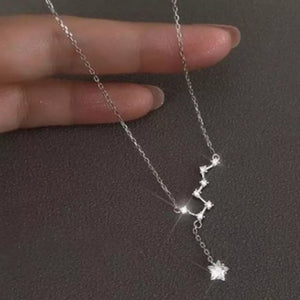 Sterling silver necklace with constellation design and star charm, available in rose gold and gold.