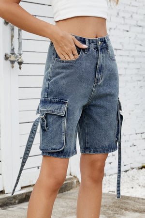 Medium blue denim cargo shorts with straps and large side pockets.