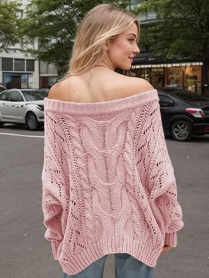 Dusty Pink cable knit off-shoulder sweater with slouchy fit and open knit details.