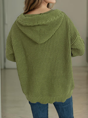 Moss green cable knit hoodie with toggle detail and ribbed texture.