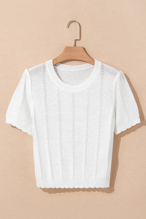 White eyelet knit puff sleeve top with scalloped hem and neckline.