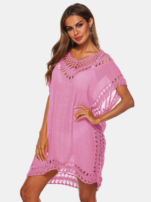 Pink kaftan cover-up with crochet trim and V-neck.