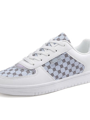 White canvas court sneakers with a patterned panel and lace-up closure.