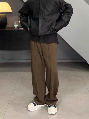 Men's brown relaxed fit wide leg sweatpants with front seam detail.