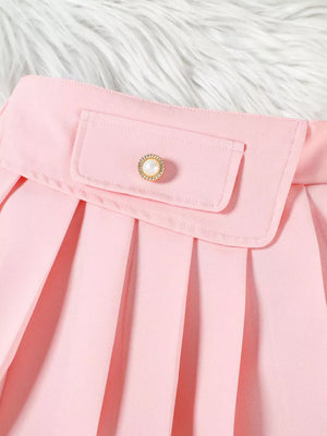 Pink baby skirt with pleated detail and decorative pearl button pocket.