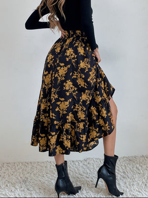 Black floral print midi skirt with tiered ruffle hem and smocked waist.