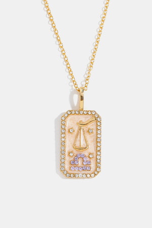 14K gold-plated Libra zodiac sign crystal pendant necklace with a rectangular pink enamel charm and clear crystal border.