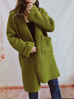 Chunky knit cocoon cardigan coat in moss green with pockets and cuffed sleeves.