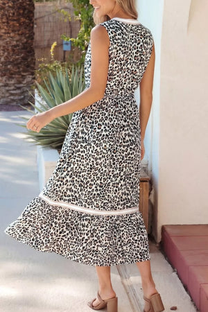Leopard print midi dress with a tiered hem and contrast trim, sleeveless with a V-neck.