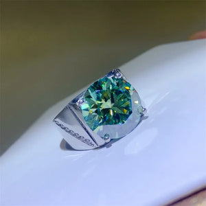 Emerald cut moissanite signet ring in silver with a large green stone.