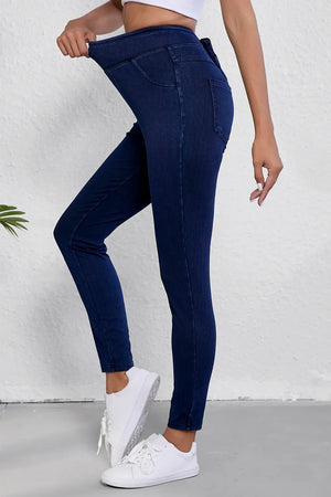Dark wash denim jeggings with faux pockets and a comfortable stretch waistband.