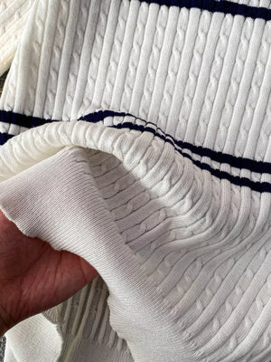 White cable knit polo t-shirt with navy stripes and a soft texture.