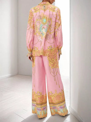 Pink baroque print two-piece set with lantern sleeves and wide-leg pants.