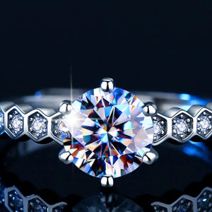 Radiant moissanite silver ring with hexagon band and certificate.
