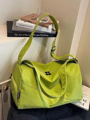 Green Oxford cloth travel organizer bag with adjustable strap and side zipper pocket.