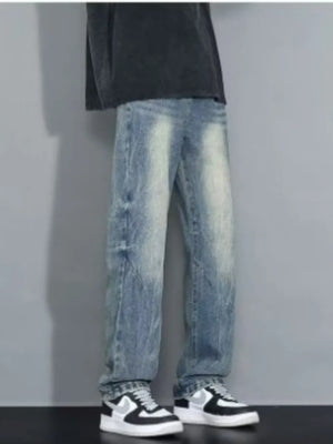 Men's loose-fit jeans in blue wash with distressed details.