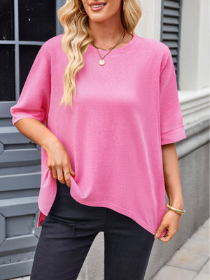 Pink relaxed fit t-shirt with drape sleeves and a crew neck, styled casually.