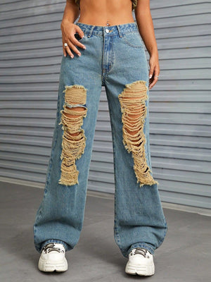 Medium wash distressed denim flare jeans with raw edge details and ripped knees.