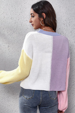 Colorblock knit cardigan with balloon sleeves in white, yellow, purple, and pink acrylic.