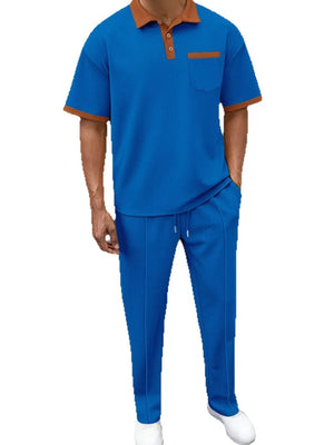 Blue textured polo shirt with contrast collar and pocket, and matching track pants.