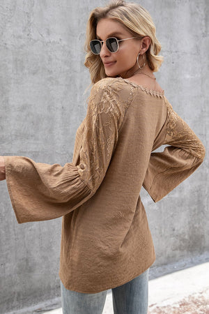Camel blouse with lace sleeves and scallop trim neckline.