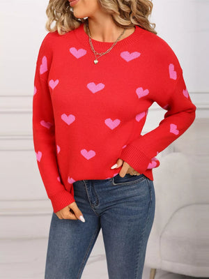 Red acrylic sweater with pink heart print, crew neck, long sleeves.