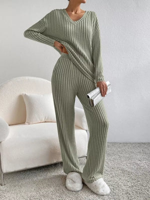 Green ribbed knit V-neck loungewear set with long sleeves and wide-leg pants.