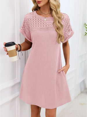 Blush pink t-shirt dress with short sleeves and a sheer lace yoke detail.