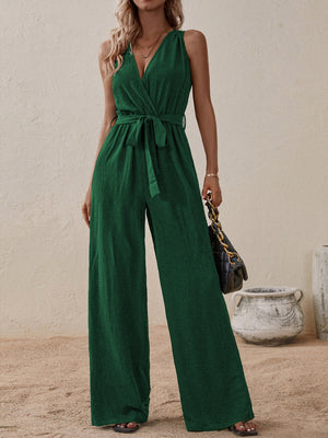 Dark green textured wrap-front wide-leg jumpsuit with tie waist and V-neck