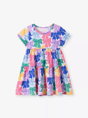 Baby tiered dress with colorful bow print, short sleeves, and round neckline.