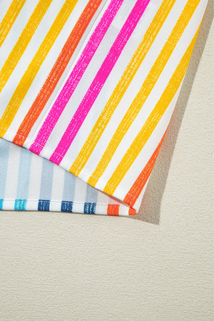 Rainbow stripe relaxed fit button-down shirt with pink, orange, and yellow stripes.