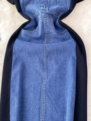 Denim patchwork short-sleeve dress in dark blue with button-down front and black side panels.