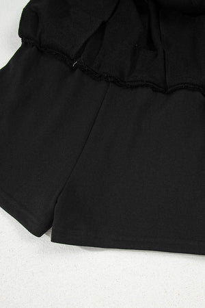 Black French terry skort with drawstring waist and pocket detail