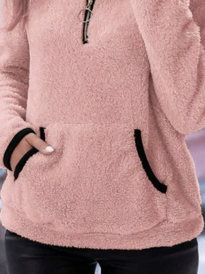 Pink fleece quarter zip pullover with black trim and front pocket.