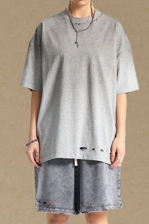 Gray oversized t-shirt with distressed neckline and hemline details.