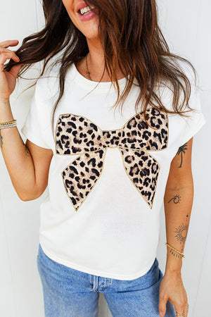 White cotton crew neck t-shirt with a large leopard print bow graphic.