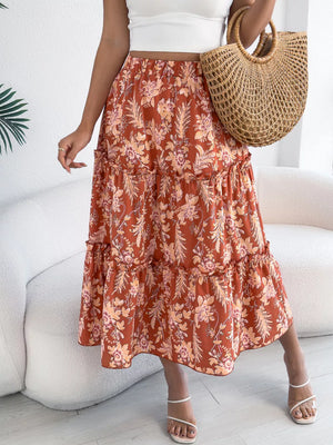 Orange floral midi skirt with ruffle tiers and a tiered hem.