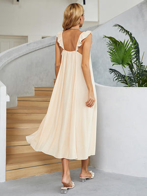 Cream midi slip dress in 100% rayon with ruffled straps and A-line cut.